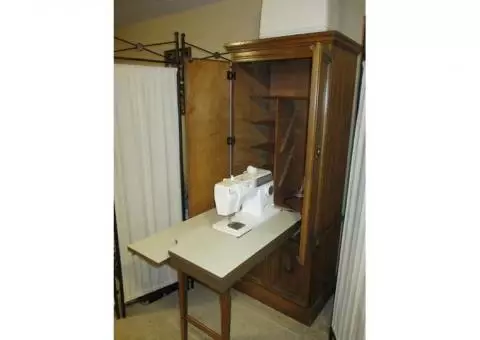Solid pecan cabinet with portable Singer sewing machine